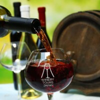 Red wine being poured into a Winery Tours Japan glass in Yamanashi