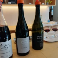 Three Château Sakaori Muscat Bailey A bottles with red wine tasting glasses in Yamanashi
