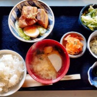 Roast pork lunch with rice, soup, salad and pickles in Yamanashi