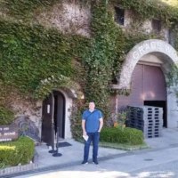 Guest outside the ivy-covered Grace Wine winery in Katsunuma, Yamanashi